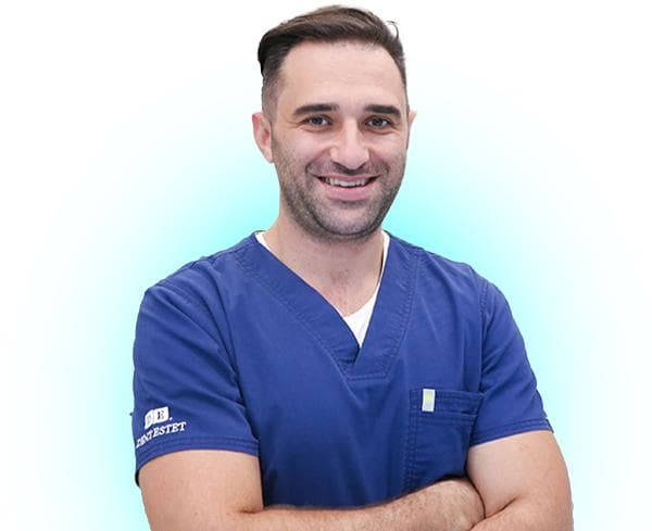 Dentist București - Dr. Dan Straja, medic stomatolog estetică dentară, atestat în implantologie.