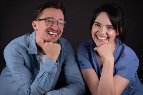 Smiling patient and dentist, revealing amazing dental aesthetics.